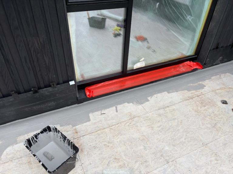 Matting being applied to the roof terrace of this Kendal new build