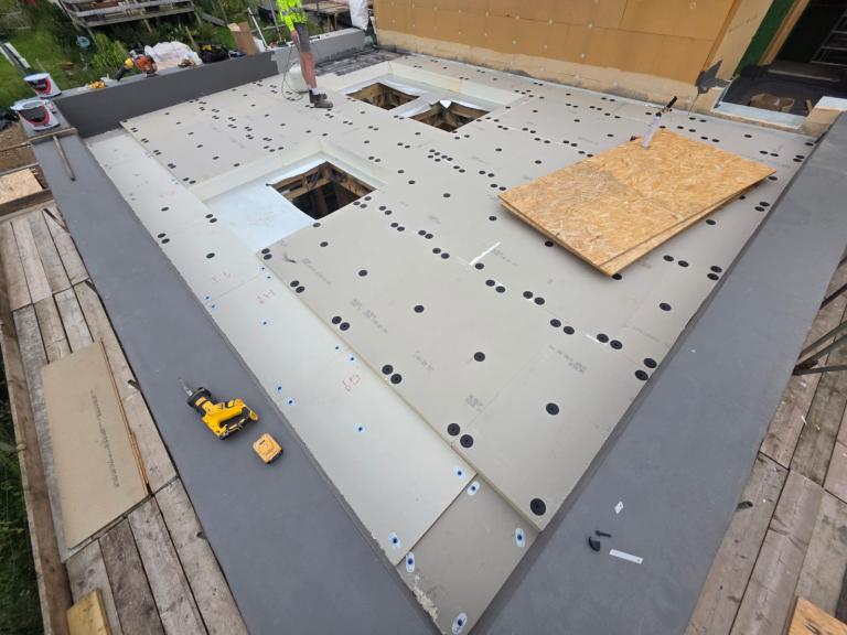 The main warm roof area (which will become a green roof), with the VQ insulation being applied