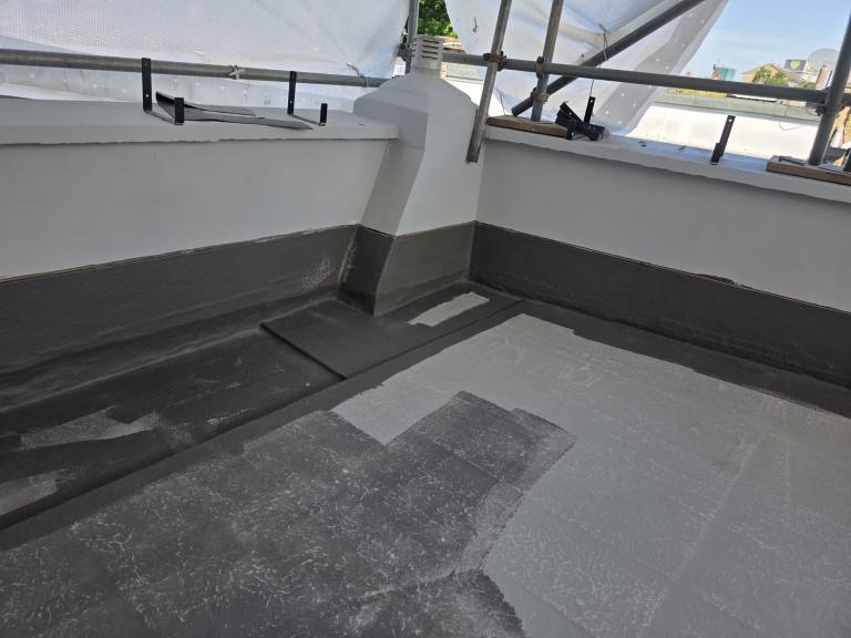 The balcony terrace area as the top coat is applied