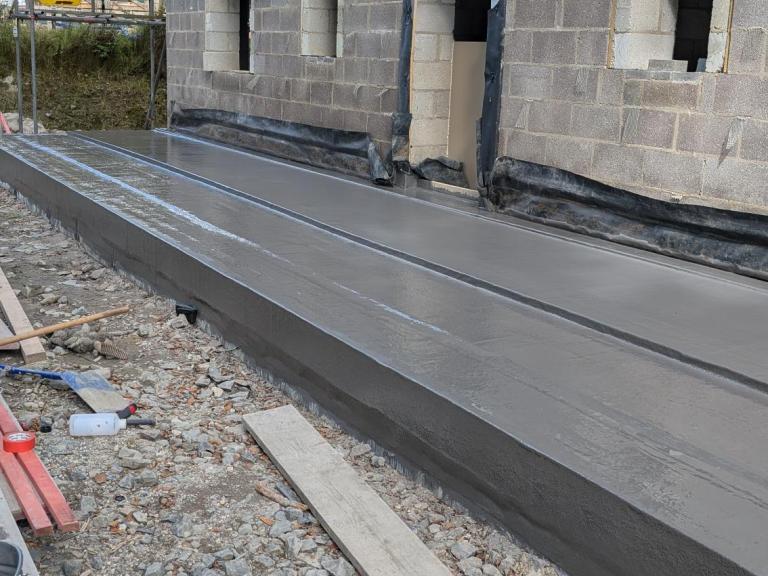 The completed basement roof stretches the length of this newbuild property