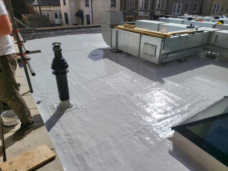 The roof dries in the sun - however polymer roofing can be applied in almost any weather