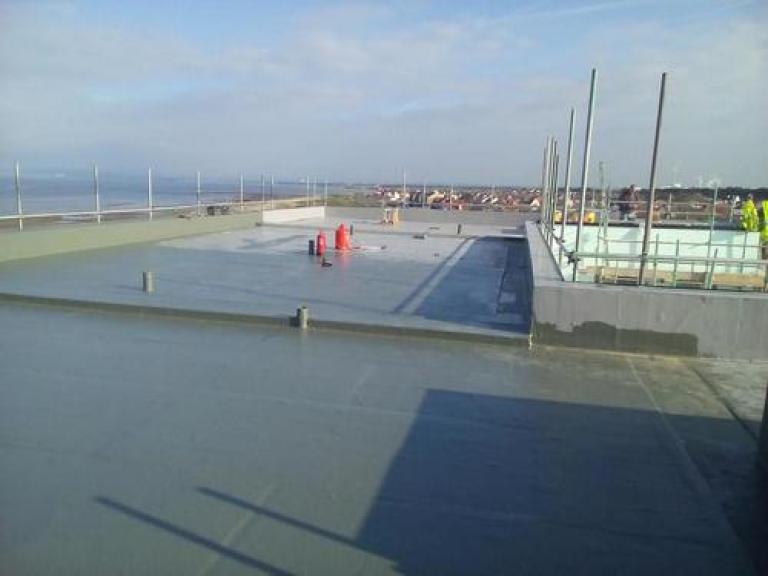 Despite work being done in stages, the system forms a jointless seamless covering, minimising ingress from water and wind