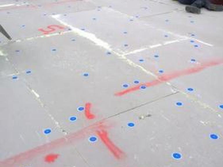 The insulation layer begins to go down on the large topmost roof, which will be covered in solar panelling