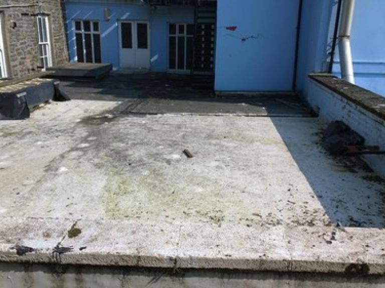 The mastic asphalt roof area was tired and leaking