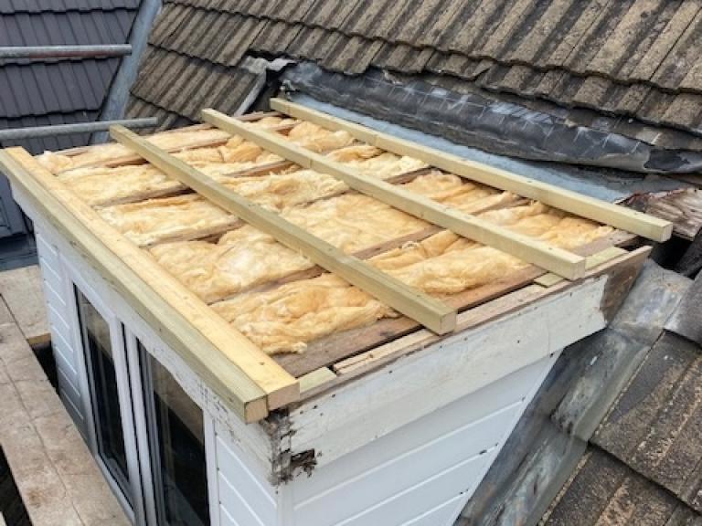 Interjoist insulation being fitted
