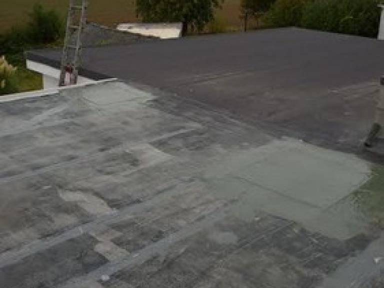 The patchwork quilt effect typical with old mineral felt roofs