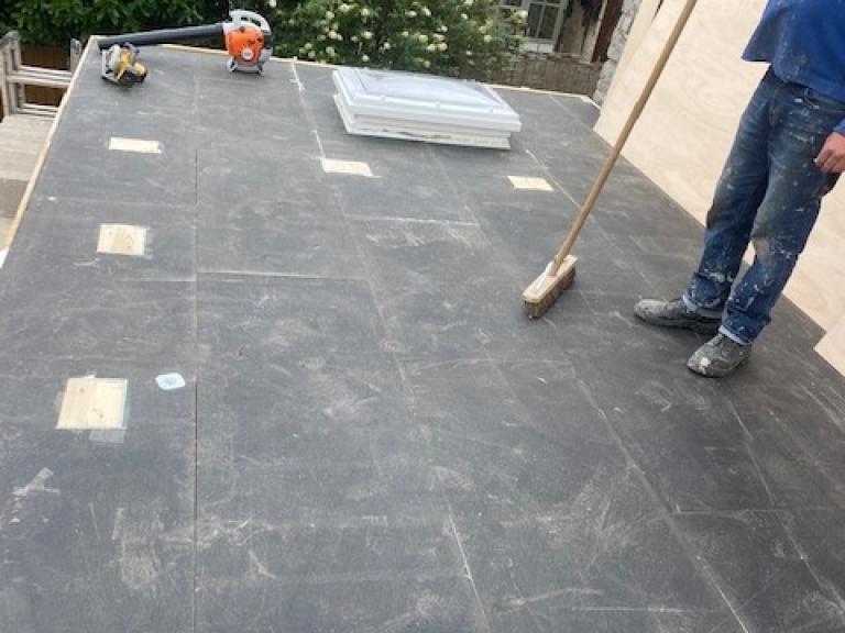 The area is then swept clean ready for the ply layer