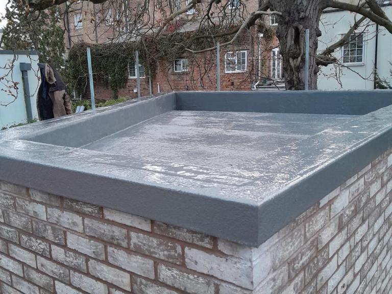 The faint gradient (easily enough to transport water away) can be seen from this angle