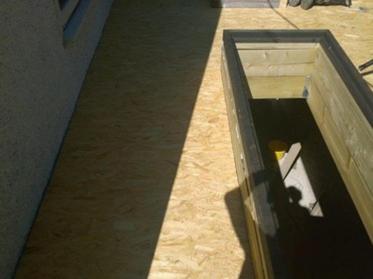 The roof was boarded to the edge of the long skylights