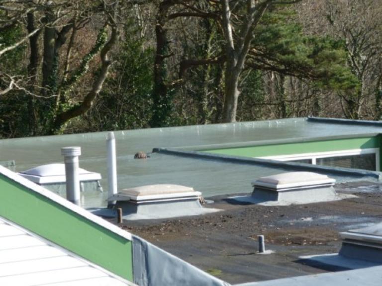 The liquid polymer roofing overlay was installed...