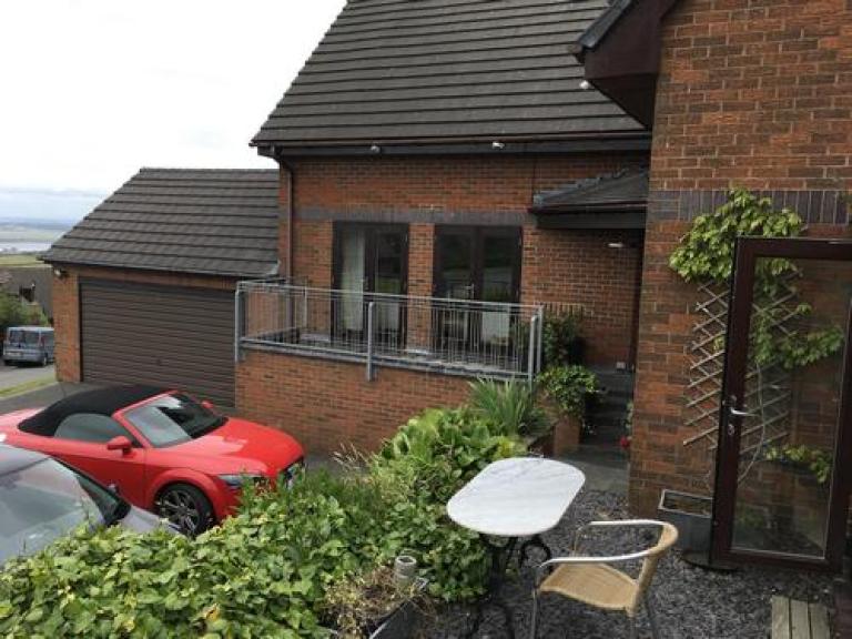 The railings fitted to the outside of the wall, also making refurbishment easier