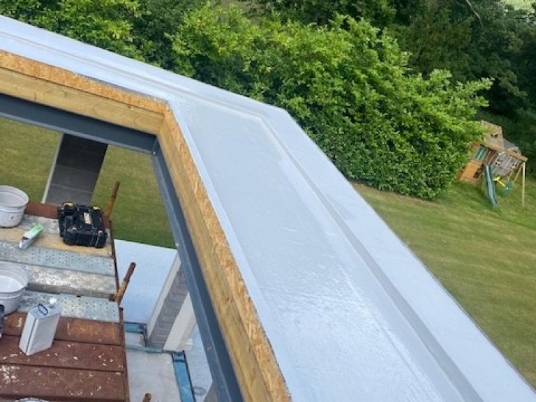 This tilts water to the channels, which then move it back towards the gutters