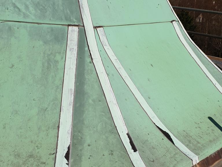 The old roof was pocking and eroding, with badly perished seams