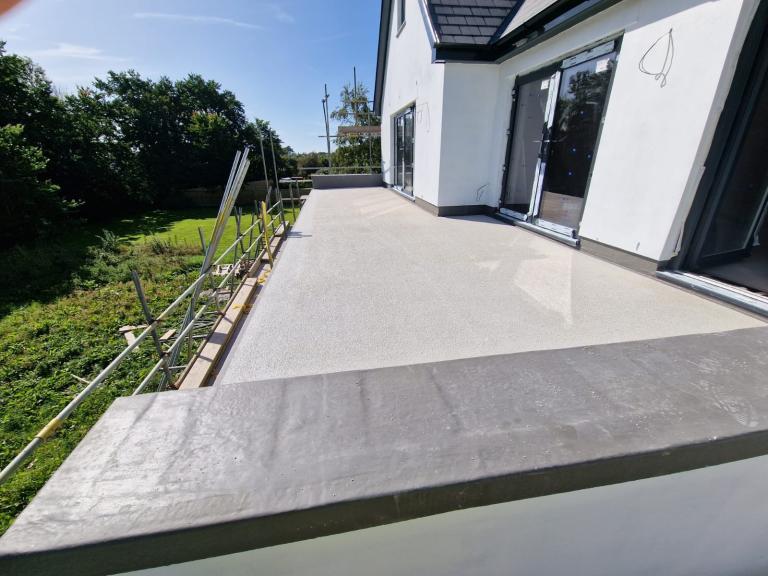 This newbuild features a sizeable terrace with two patio french doors