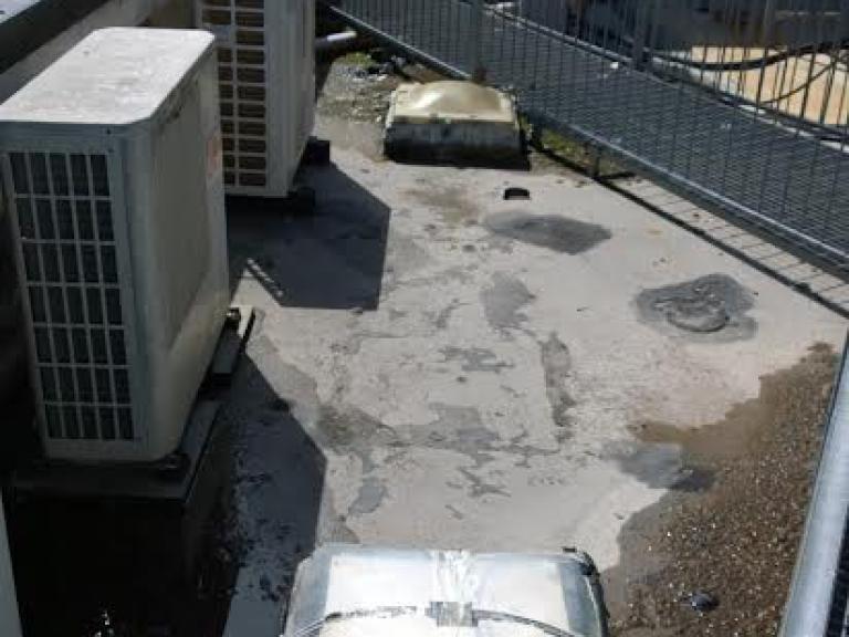 Ensuring the Air Conditioning Units were raised on wooden struts