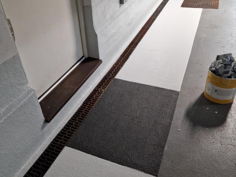 Grating was installed over the channels and sills replaced, with everything now contained