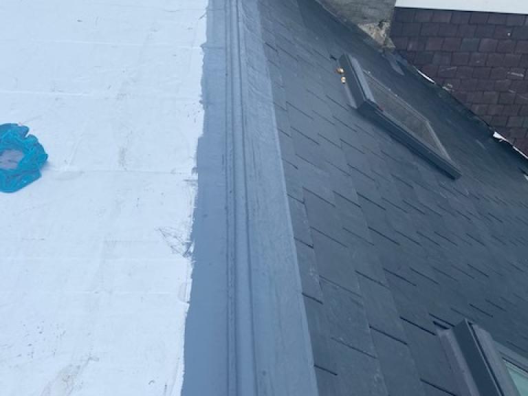 Extending the waterproofing to the chimney stack to seal all water ingress points