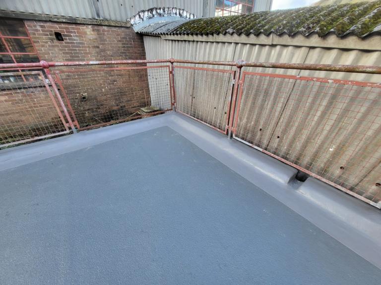 Notice the easy-on-the-eye channels to keep this balcony area puddle-free