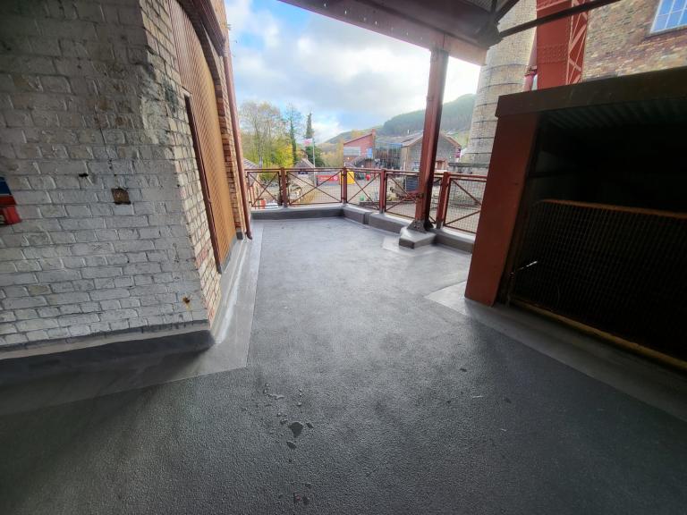 The same channels and upstand-protection extend to smaller balcony areas such as this one overlooking the site