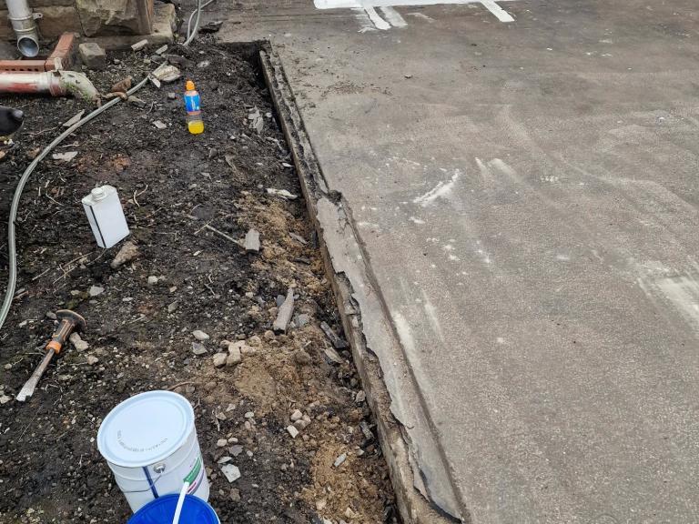 Some of the degraded mastic asphalt, displaying a high degree of damage