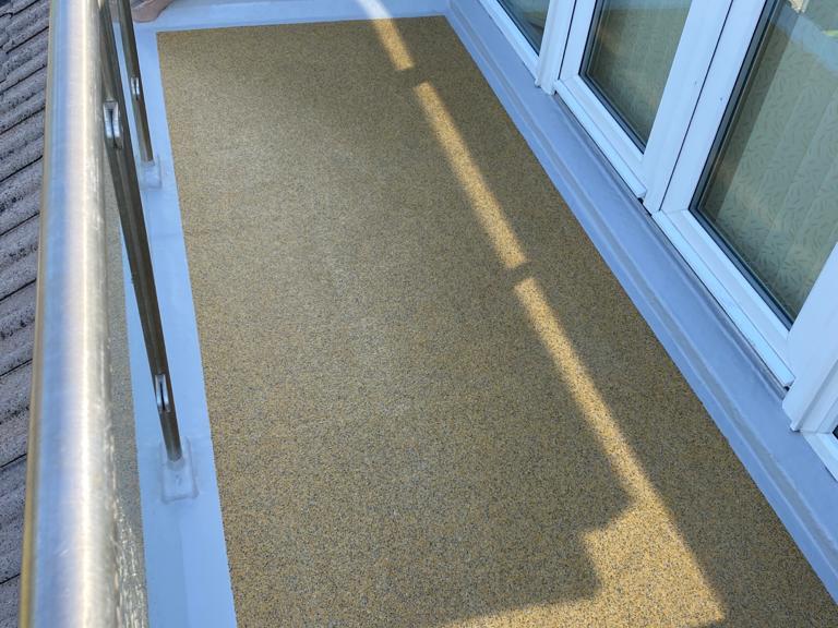The area was then finished with a pigmented quartz, making a smart and durable, anti-skid surface
