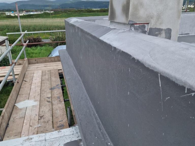 The parapet walls were insulated and encapsulated with Polyroof Flexible Protec 25yr waterproof membrane