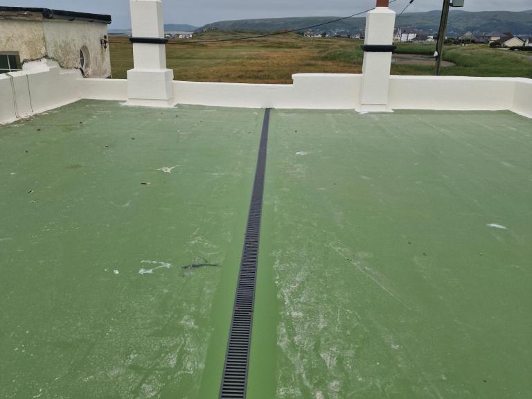 The terrace was then waterproofed and coated in Forest Green