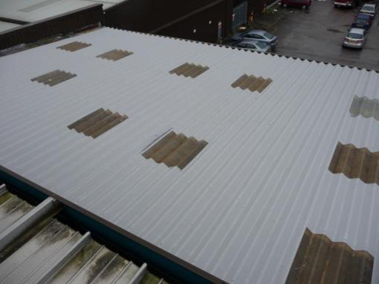 After - Top coat applied, finishing and sealing the roof