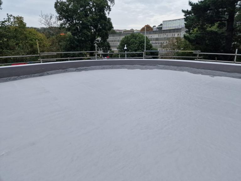 After pressure-washing, the carefully formulated layers of polymer coating were applied