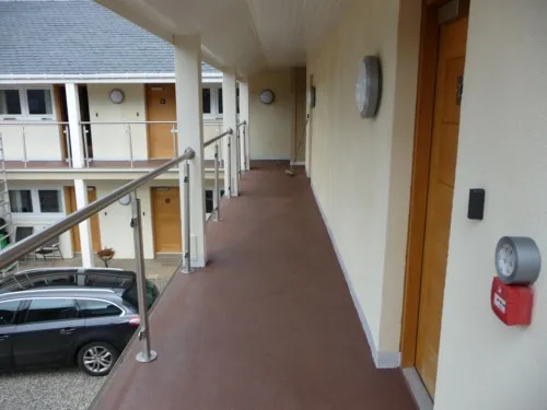 Balcony quartz system in place in Pitlochry hotel, replacing the leaking tiled walkway already there