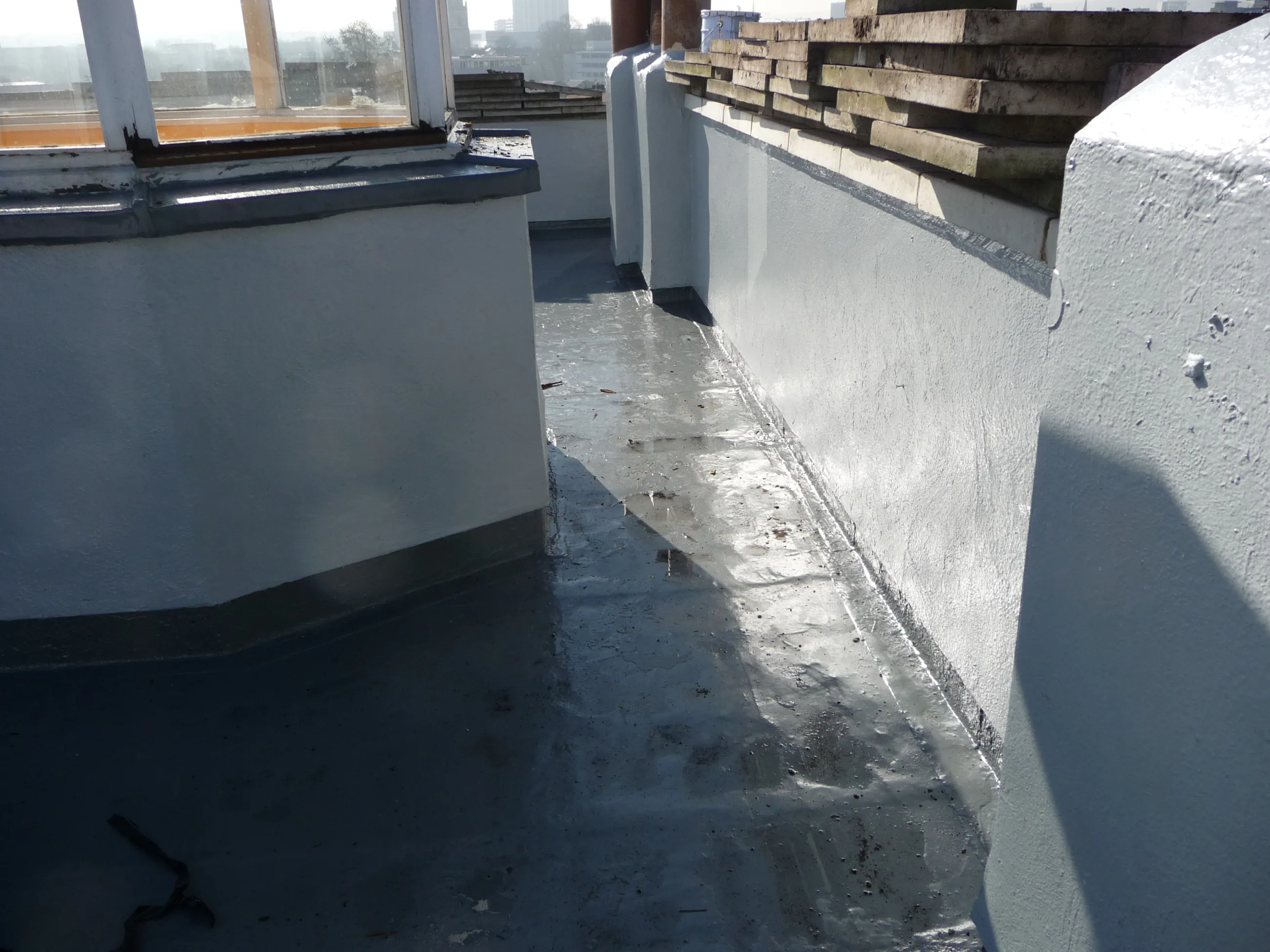 roof garden slabs removed  the  substrate has been  clean & the 2 coat jointless& seamless 15 year liquid membrane  flat roofing system applied