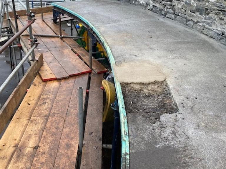 A large area of damage on the walkway