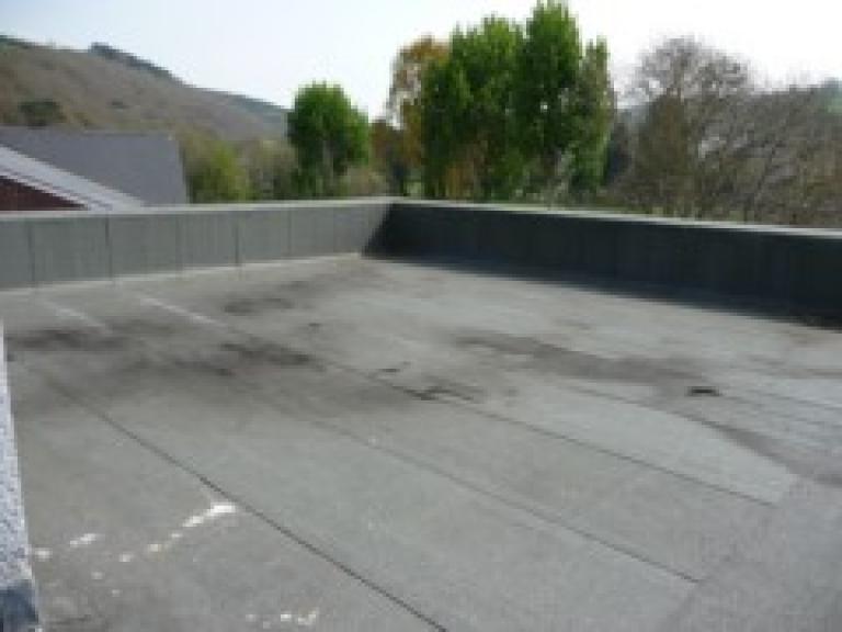 This large high grade mineral felt roof was leaking in various places