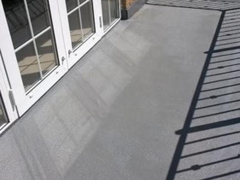 This balcony in Ascot went from puddling water to looking great