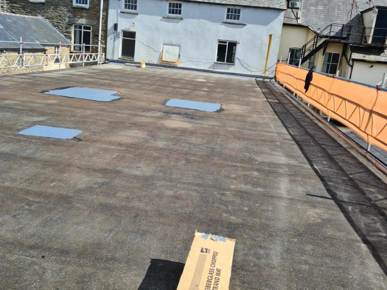 Preparation work begins on the Spar roof - pressure washing and sealing