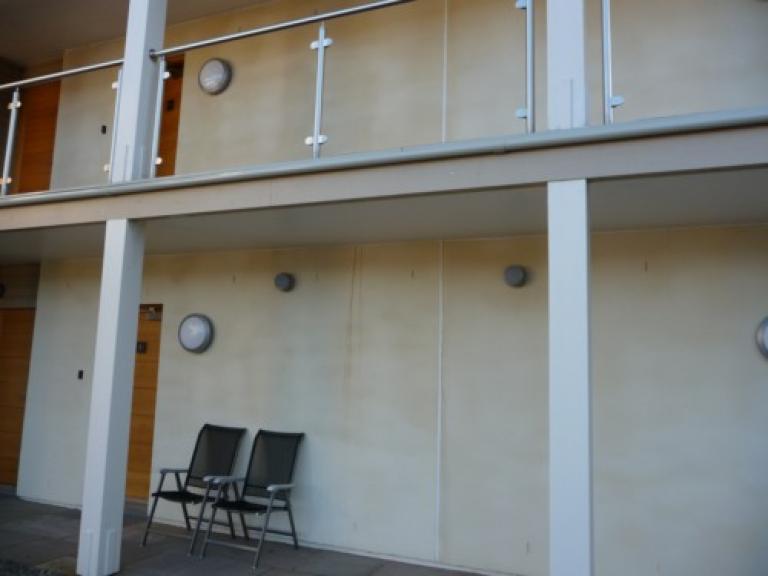 The leaking balcony walkway - note the leakage stains on the wall below