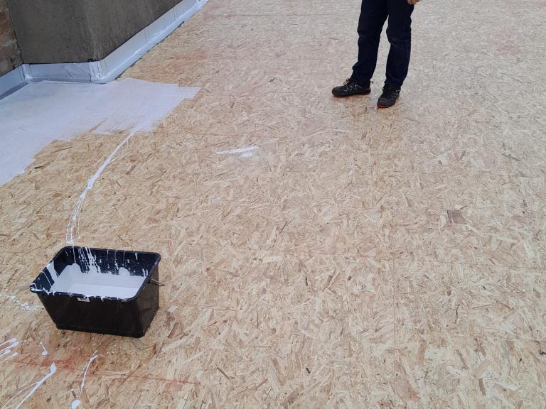 The structure was then topped with plywood to give a substrate for polymer installation