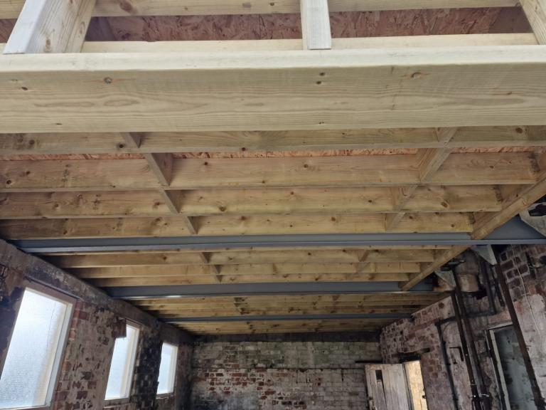 A view from below showing depth of insulation to meet U-Values