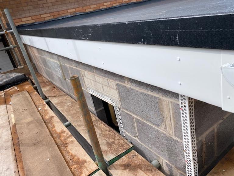Border for water retention at one end of the roof