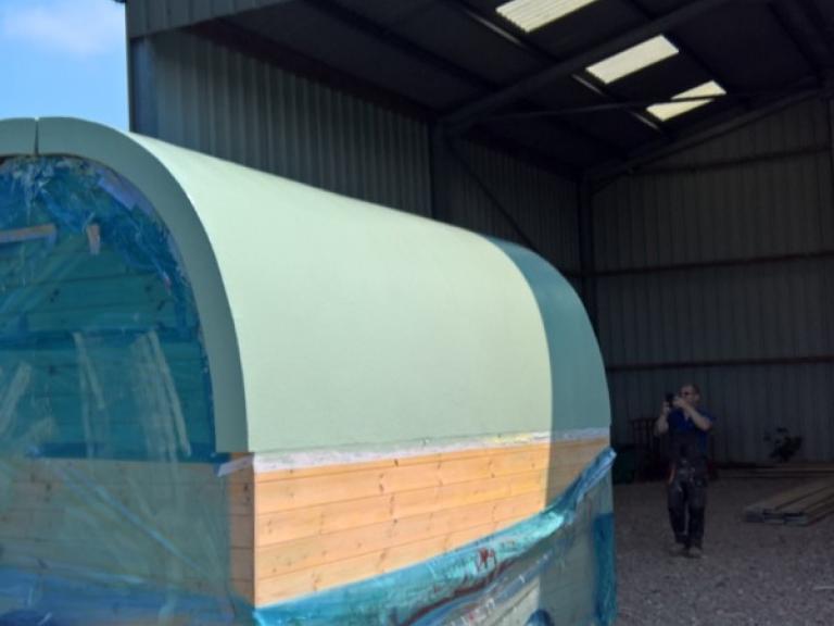 The trailer roof was then overcoated in the copper alternative verdi green polymer system