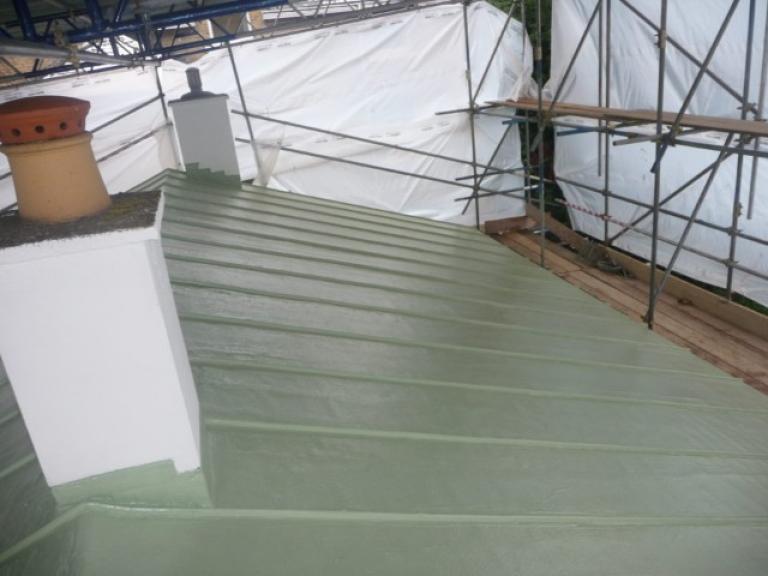The standing seams and metal edging add to the authentic copper roof look