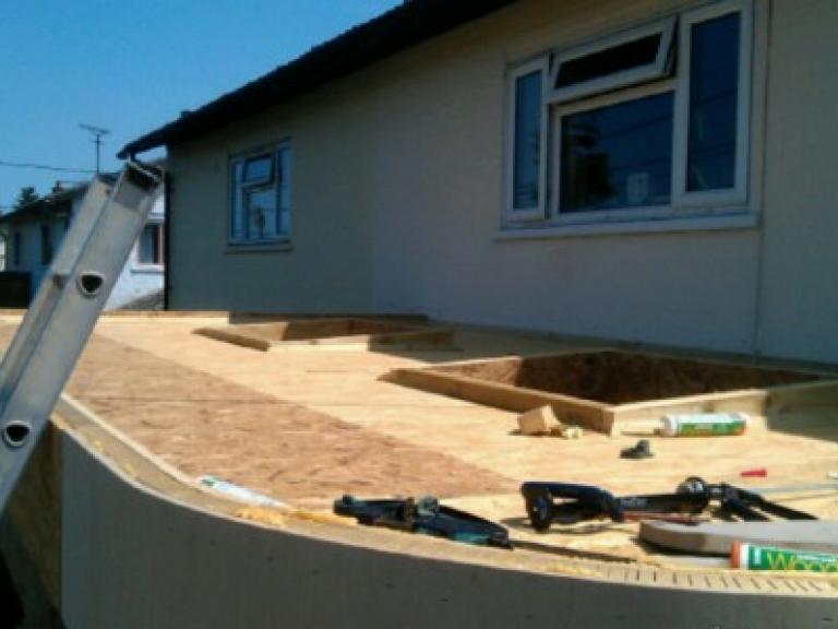 Skylight roof windows set into curved flat timber roof