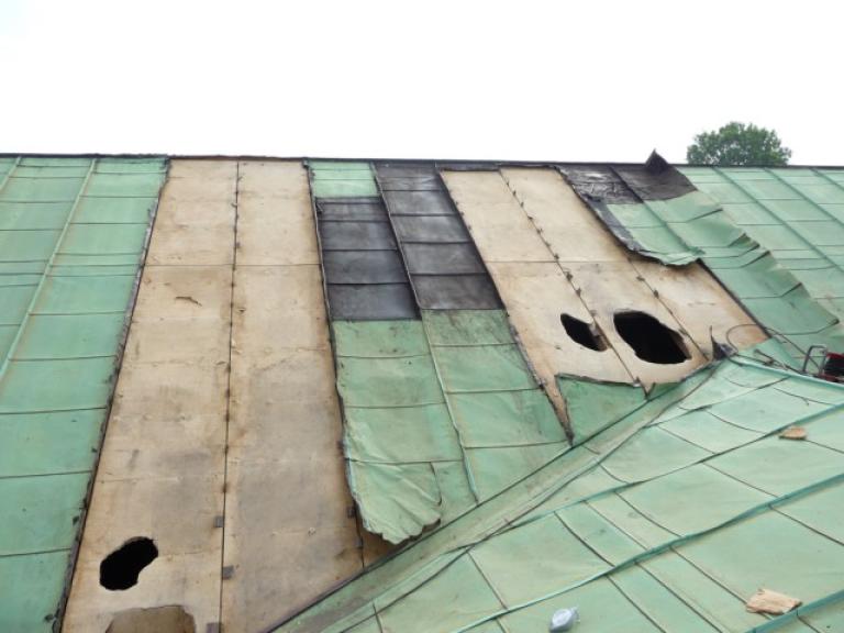 Note the damage to the lower roof