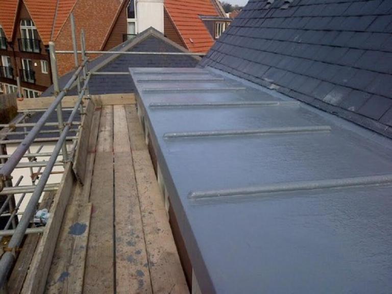 A double coating of liquid membrane top coat completes the 25 year system