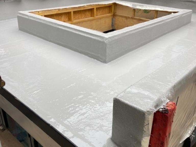 The polymer system being installed around a central skylight