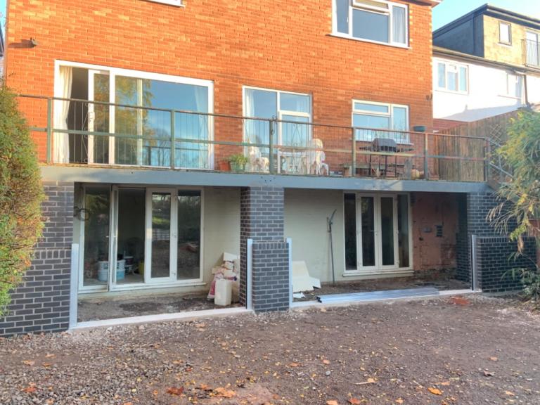 The balcony sits on a steel-edged concrete substrate which is wicking water