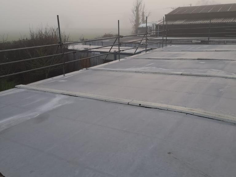 Prior to refurbishment, the roof was lumpy, splitting and retaining damp