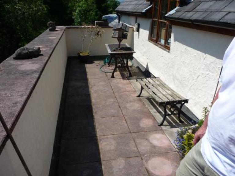 Leaking felt roof terrace in Oswestry, before...