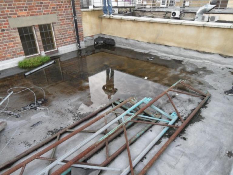 The flat roof was flooded, with no way for surface water to drain