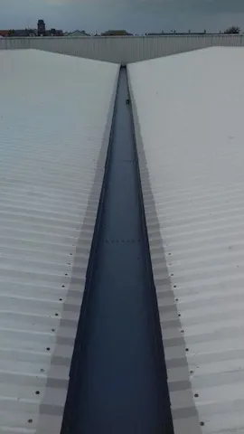 Treated roof and 20 year gutter relining system in place on the Argos in Aberystwyth